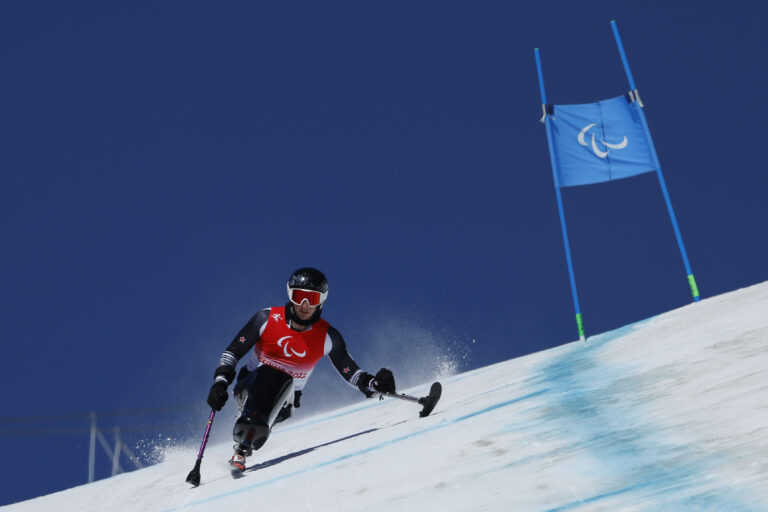 Aaron Ewen ski's down a mountain at the Beijing 2022 Paralympic Games.
