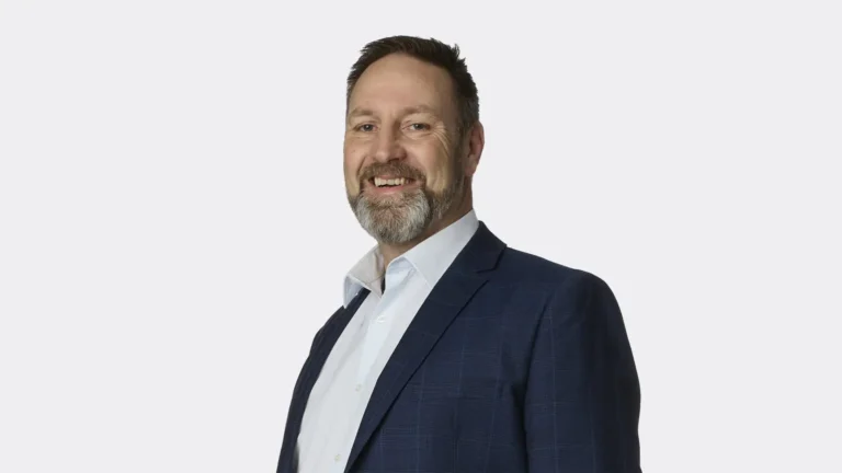 A professional portrait of Kelvyn Eglinton.