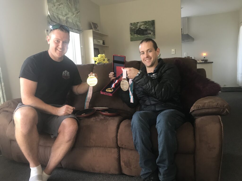 Adam Hall shares Paralympic medals with best friend Brett.