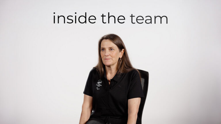 Lynette Grace sits in front of a white backdrop with text overlaid reading "Inside the Team"
