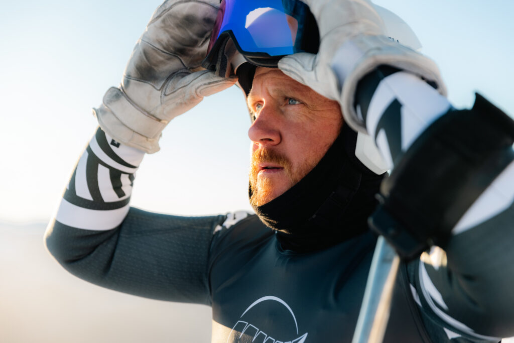 Corey Peters prepares to pull his ski goggles over his eyes.
