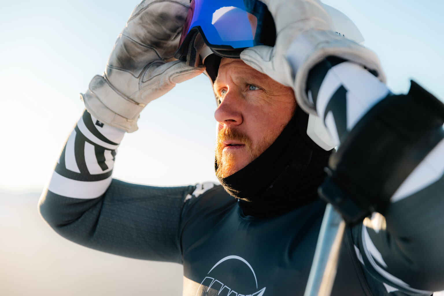 Corey Peters prepares to pull his ski goggles over his eyes.