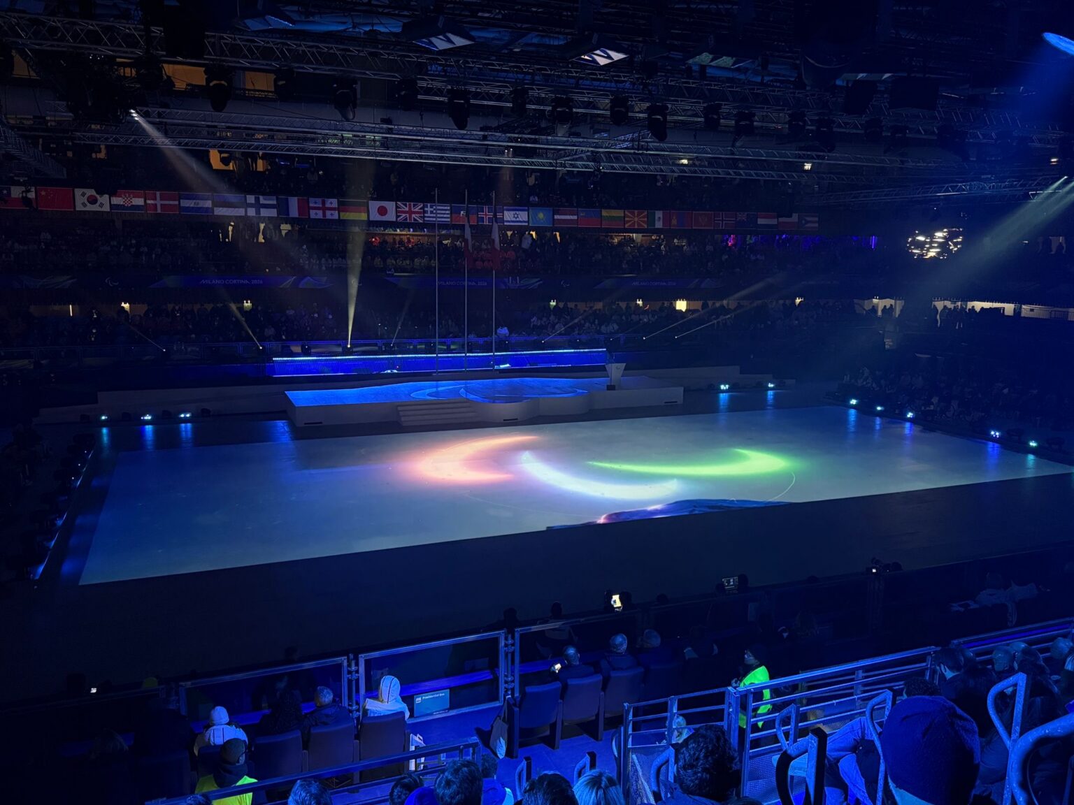 The stadium with the agitos projected in lights onto the floor