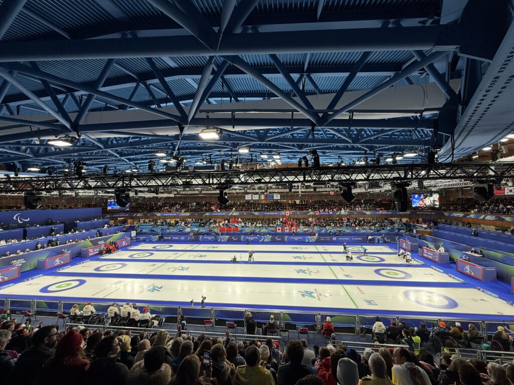 curling rink with spectators looking on