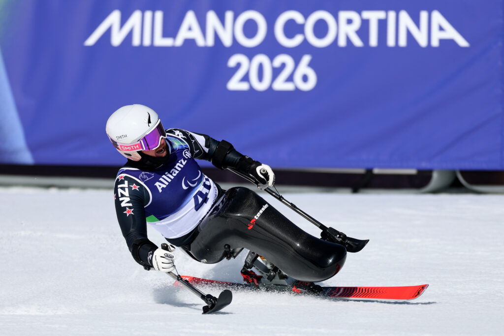 Corey Peters decelerates in the finish area on his sit ski after finishing fifth in the Men's Downhill Sitting at the Milano Cortina 2026 Paralympic Winter Games.