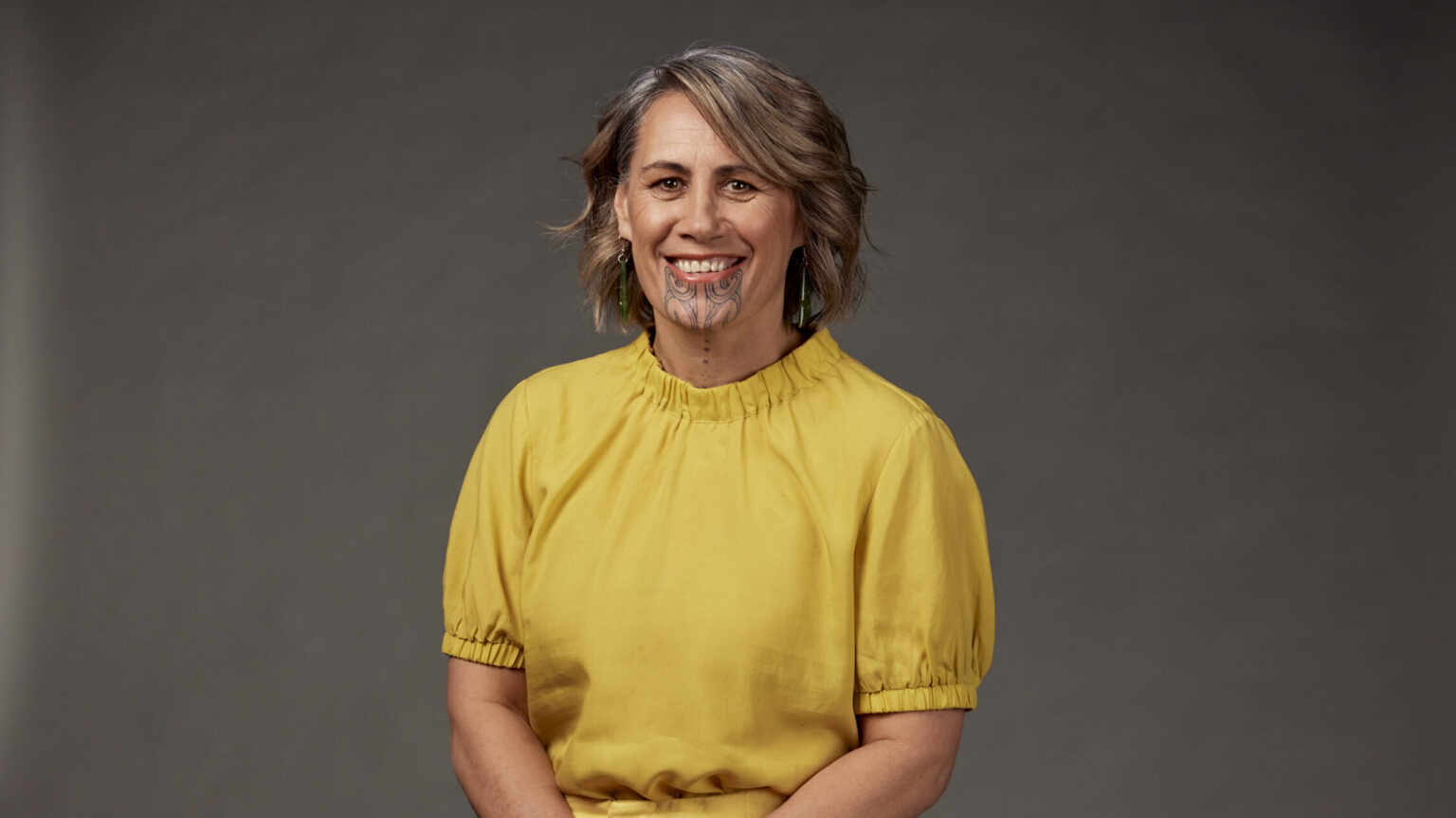 TV presenter Jenny-May Clarkson poses in a yellow top