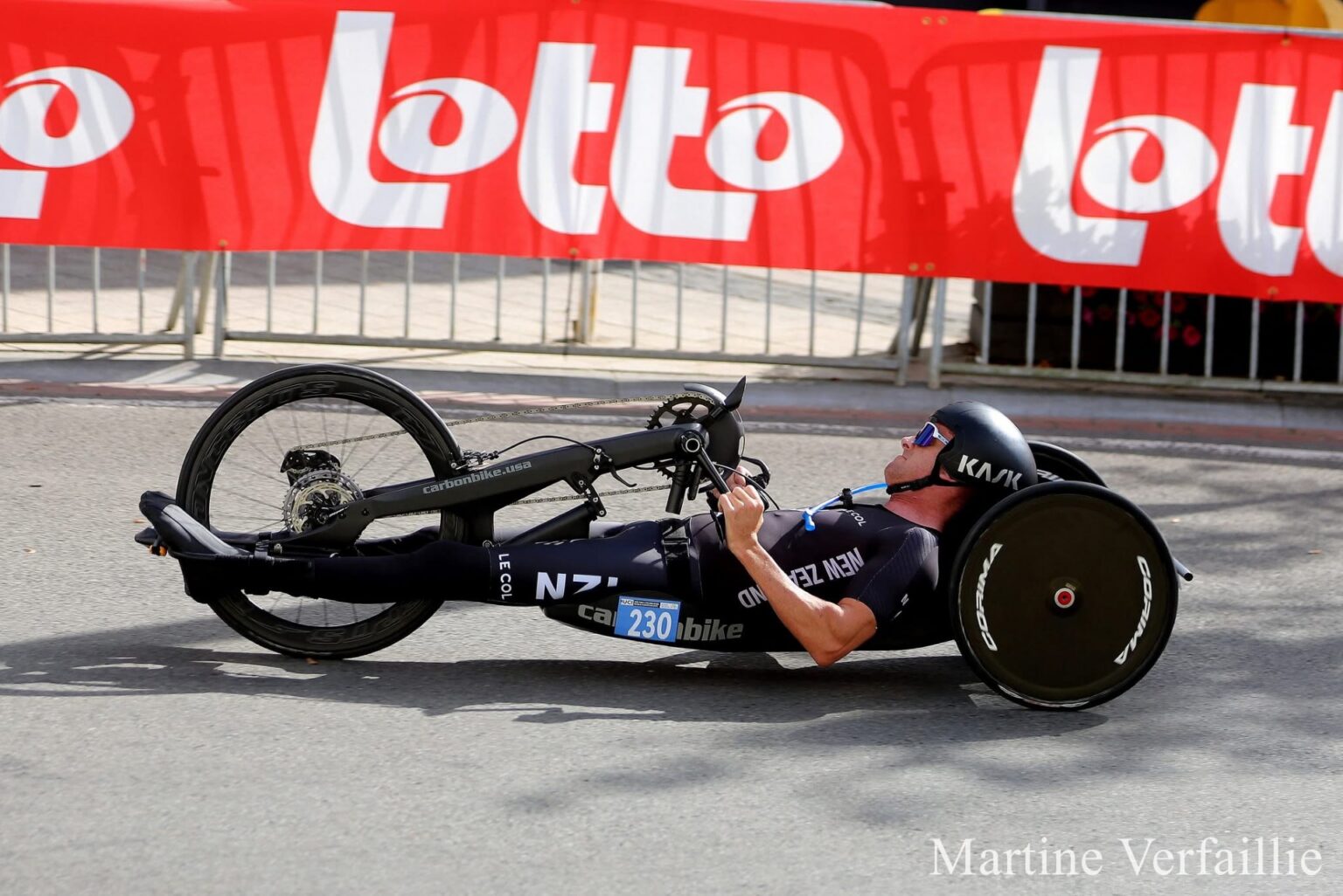 Rory Mead pedals a handcylce in a road race.