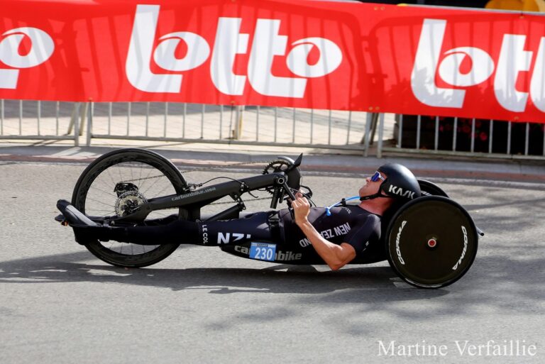 Rory Mead pedals a handcylce in a road race.