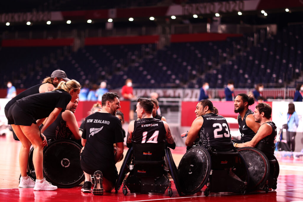The Wheelblacks have a team talk on the court at Tokyo 2020. 