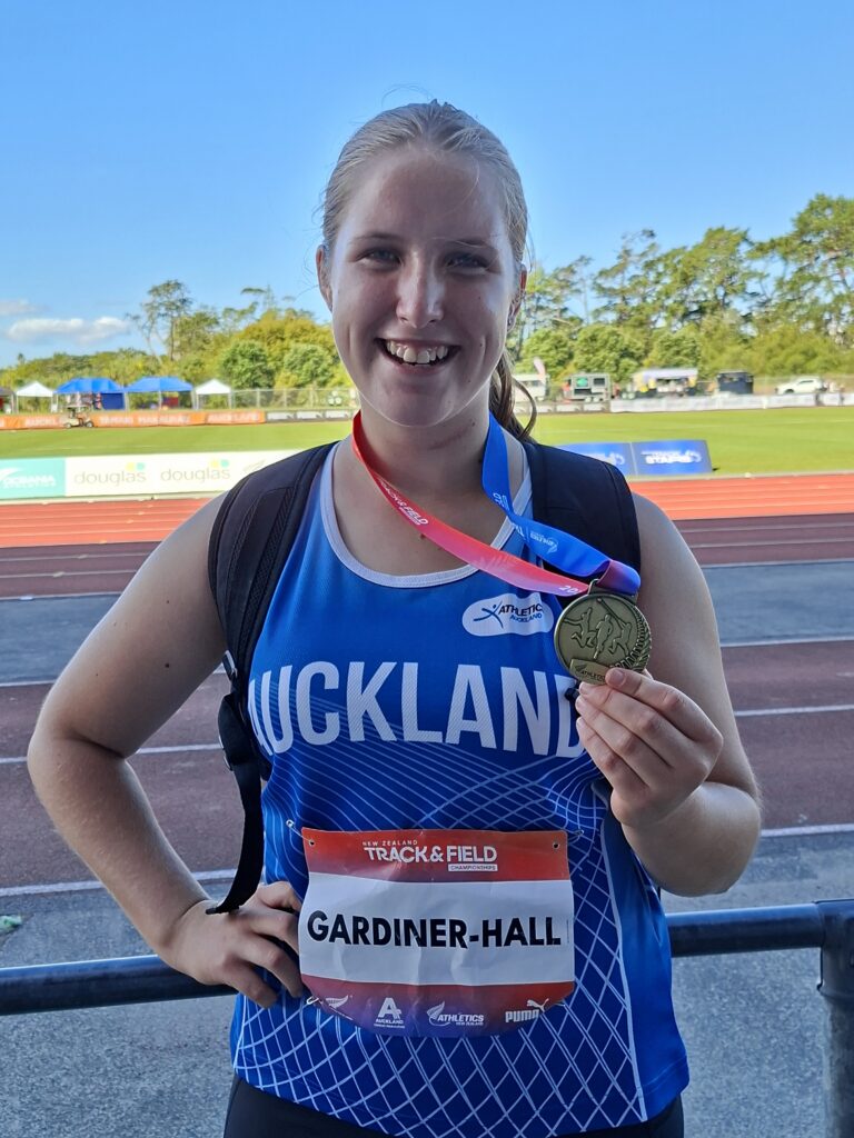 Charlie wears a gold medal following the competition.