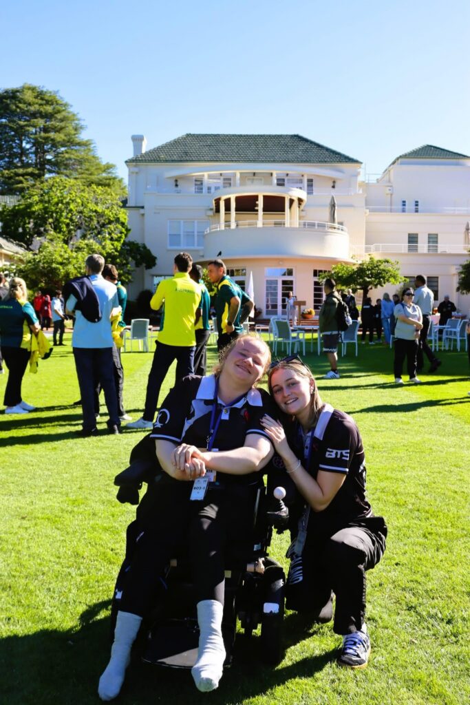 Chloe and a friend where Boccia New Zealand shirts at an event.
