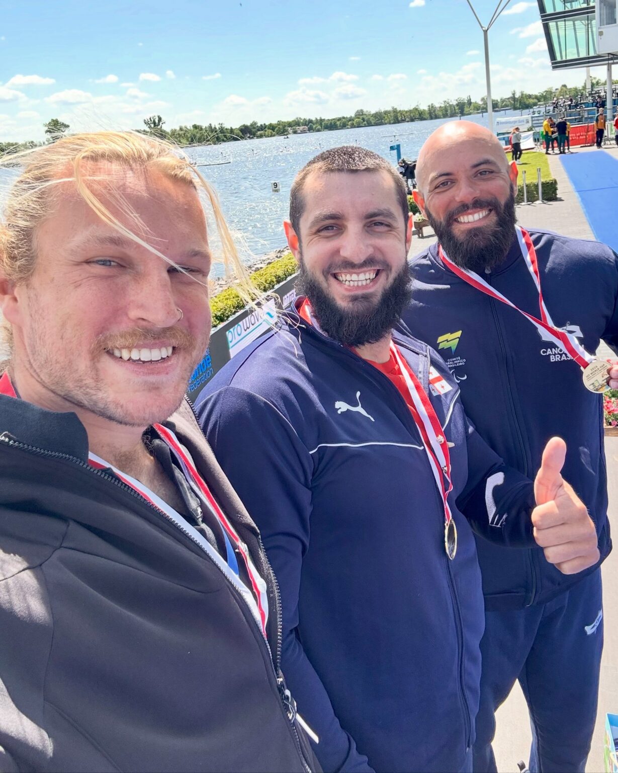 Finn Murphy takes a selfie on top of the podium at the Para Canoe world cup.