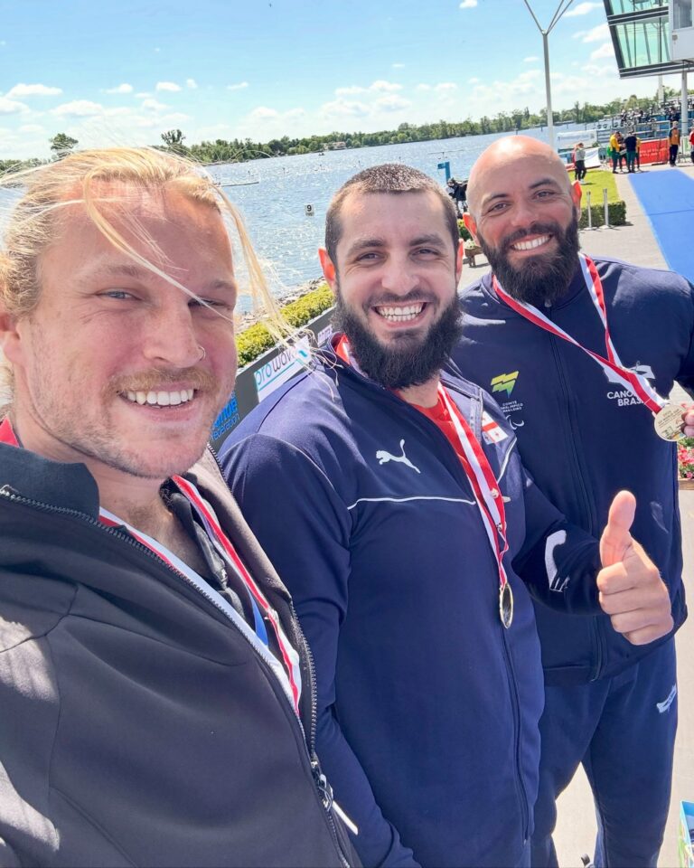 Finn Murphy takes a selfie on top of the podium at the Para Canoe world cup.