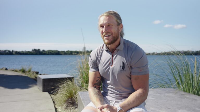 Finn Murphy sits beside Lake Pupuke.