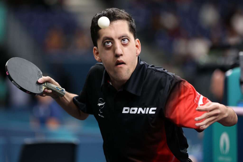 Matthew Britz prepares to rally a shot in Para table tennis at the Paris 2024 Paralympic Games.