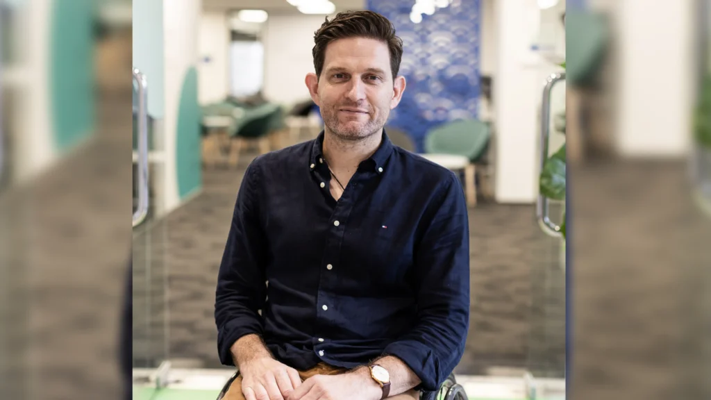 A portrait of Dan Buckingham in an office.