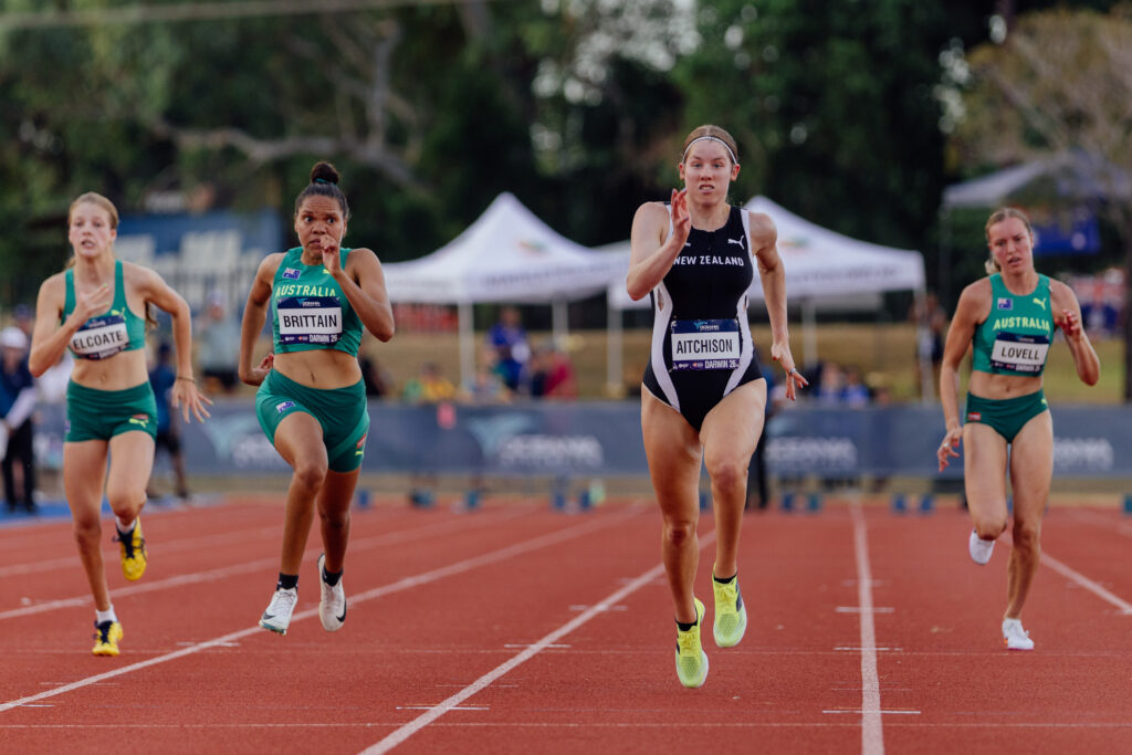 Danielle Aitchsion runs on an athletics track.