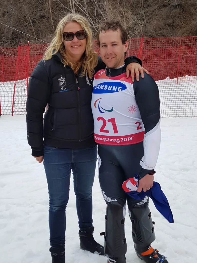 Fiona Allan and Adam Hall take a photo together on the snow.