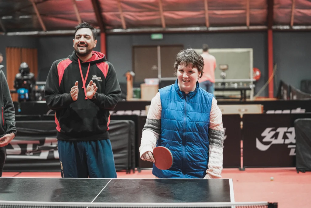 A young girl plays Table Tennis.
