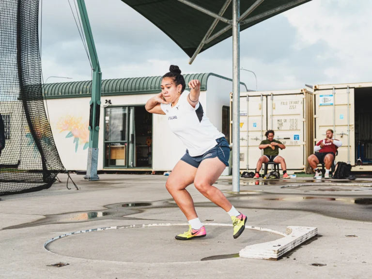 Tupou Neiufi throws a shot put.
