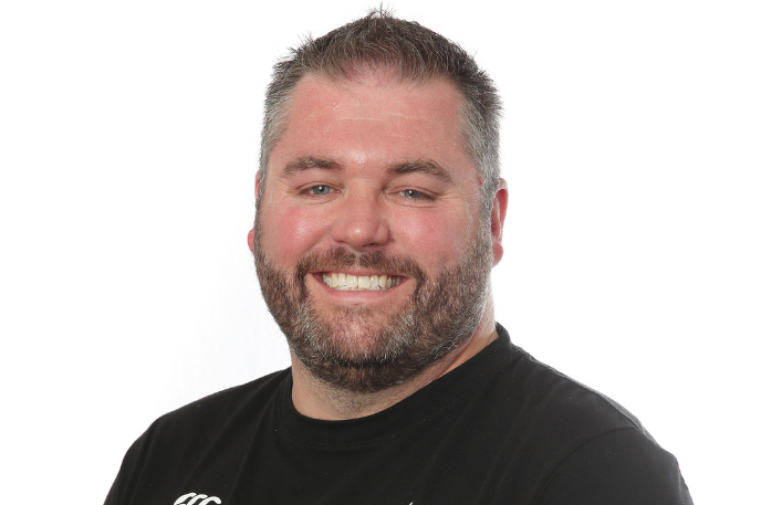 Mike Todd smiles for a portrait.