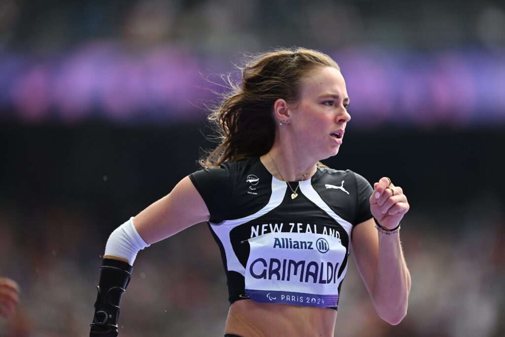 Anna Grimaldi sprinting with a side on view at the Paris 2024 Paralympic Games.