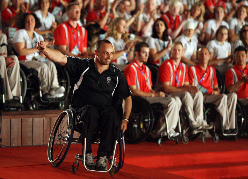 Duane waves to a crowd at the Beijing 2008 Paralympic Games.