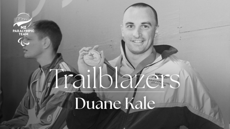A photo of Duane Kale holding a gold medal. Text overlaid reads "Trailblazers"