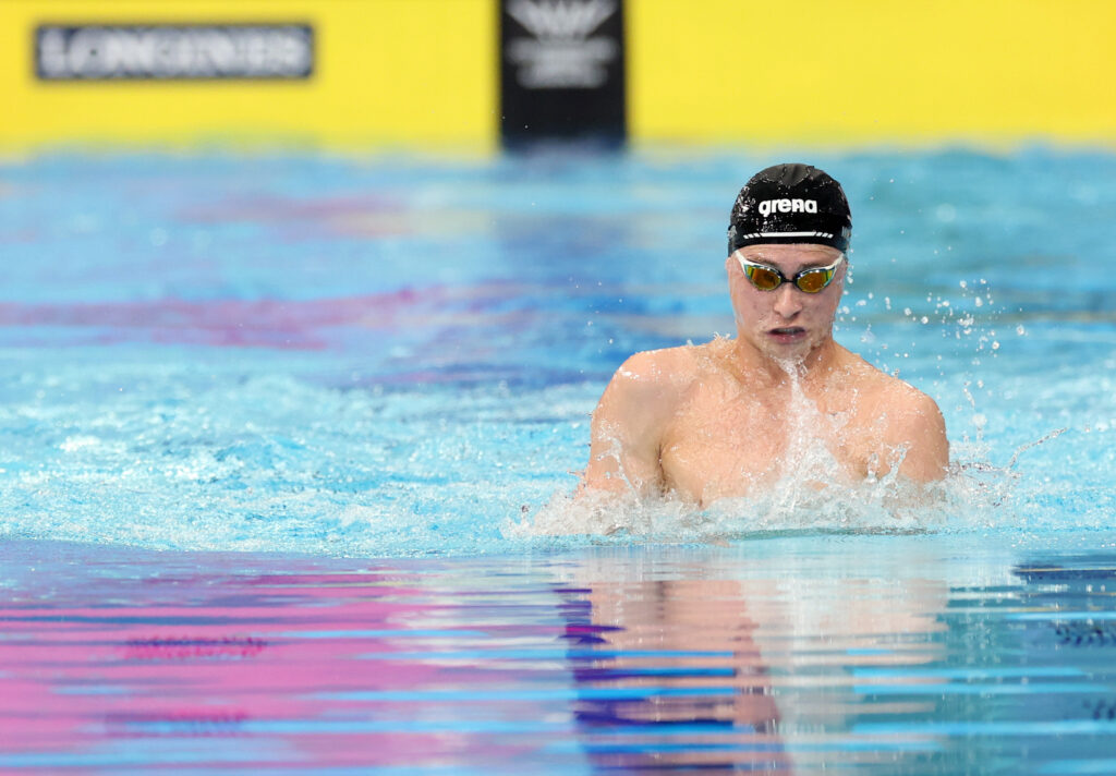 Image of Paralympian #238 Josh Willmer swimming the breaststroke with a black coloured cap at the Glasgow 2026 Commonwealth Games.
