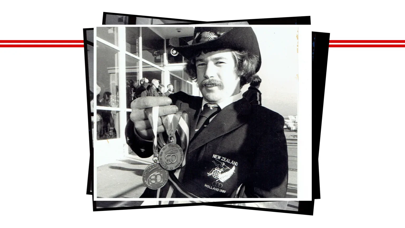 Paralympian #22 Paul Chambers holds two medals from the 1976 Toronto Paralympic Games.